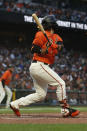 San Francisco Giants' Brandon Crawford hits an RBI single against the Oakland Athletics during the fourth inning of a baseball game in San Francisco, Friday, June 25, 2021. (AP Photo/Jed Jacobsohn)