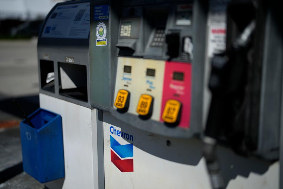 Signage is seen on a pump at a Chevron gas station, Monday, Oct. 23, 2023, in South Miami, Fla.