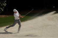 Xander Schauffele hits out of a bunker on the fifth hole during the final round of the Masters golf tournament on Sunday, April 11, 2021, in Augusta, Ga. (AP Photo/Gregory Bull)