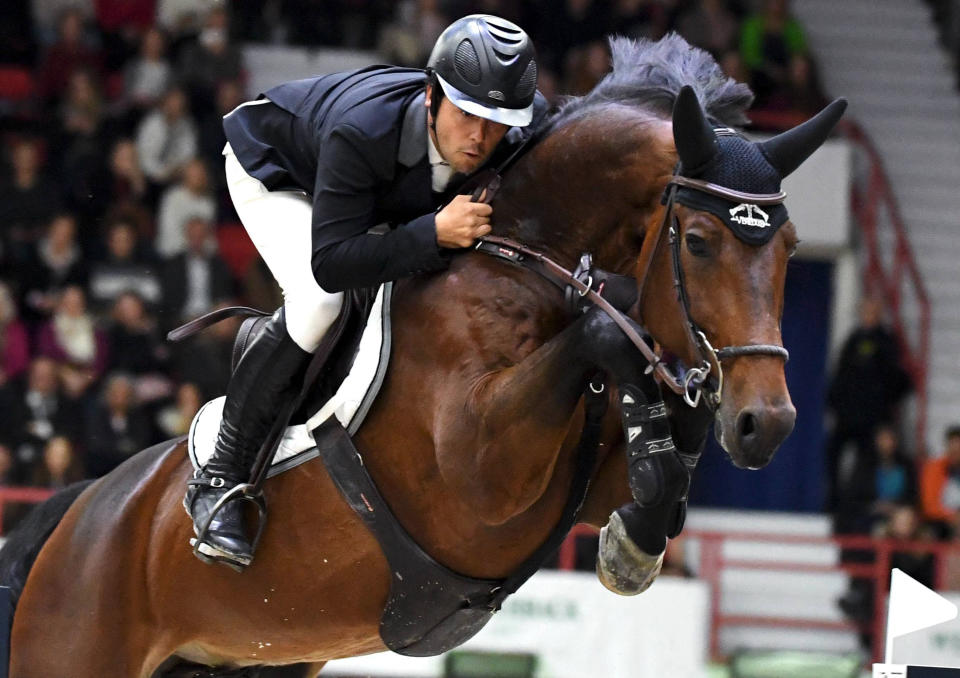 Sergio Alvarez Moya of Spain, with horse Jet Run, takes 2nd place at the Longines FEI Jumping World Cup 165 cm during the Helsinki International Horse Show in Helsinki, Finland, Sunday Oct. 27, 2019. (Jussi Nukari/Lehtikuva via AP)