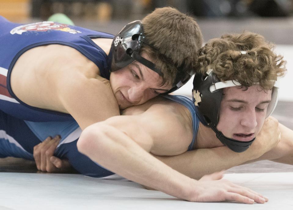 Eastern’s Jared Brunner, top,  controls St. Augustine’s Kaden Naame during the 113-pound final of the Region 8 wrestling championships at Egg Harbor Township High School, Saturday, Feb. 26, 2022.  Brunner defeated Naame, 3-0.