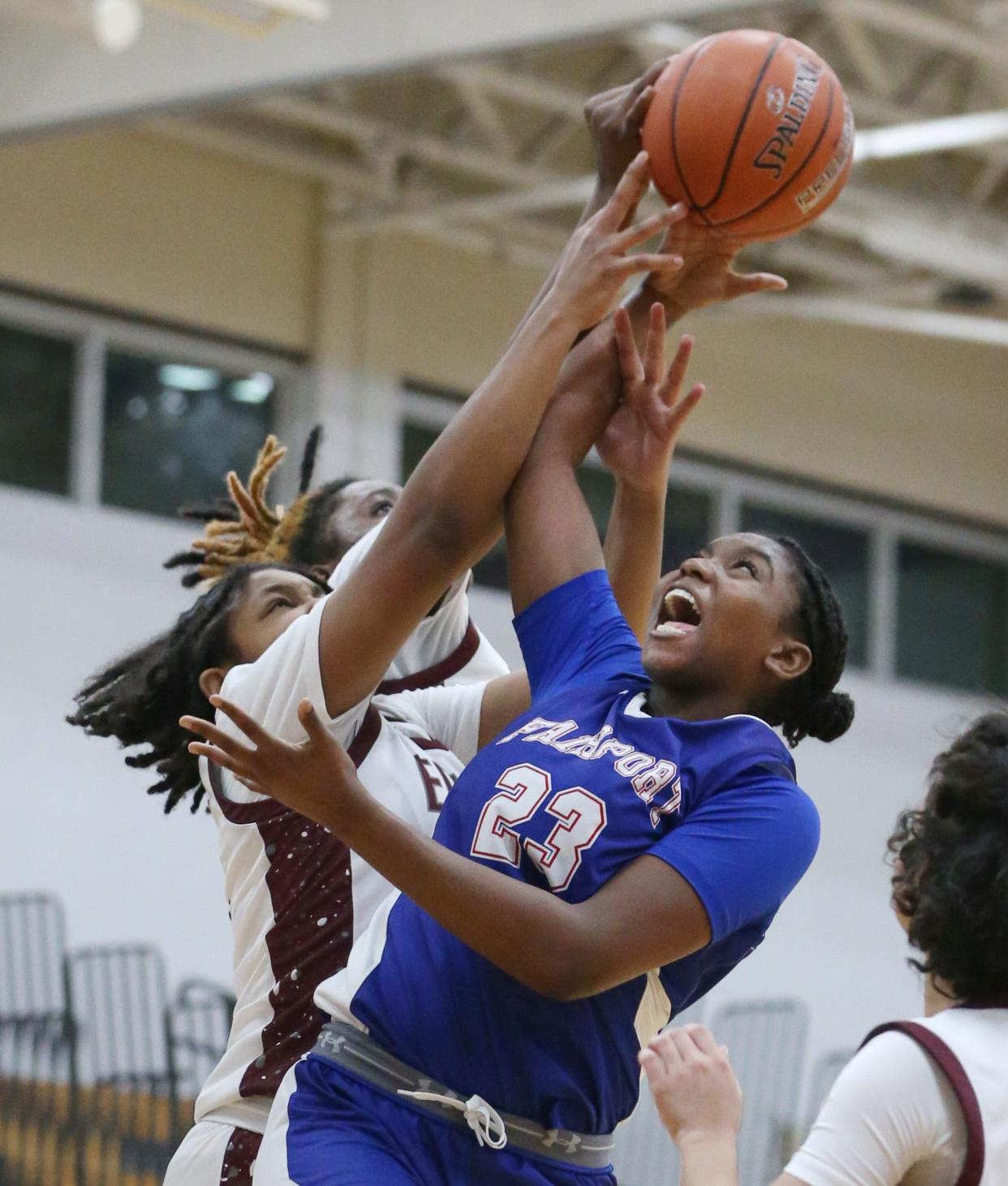 Fairport senior center Jada Crocker pulls down an offensive rebound away from Edison/WOIS/SWW forwards Laila Burnell and Kenya Scott during their Section V matchup Wednesday, Jan. 3, 2024 at Edison Tech High School. Fairport won the game 69-41.