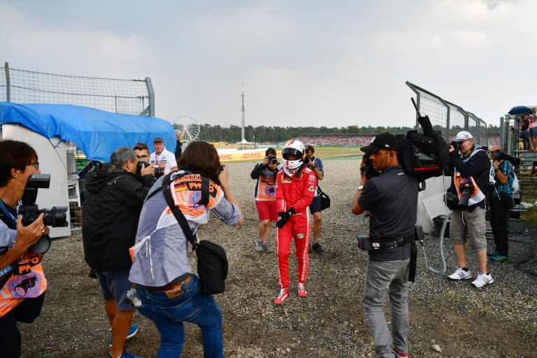 Ferrari's German driver Sebastian Vettel ended a race he led trudging back to the pits after crashing