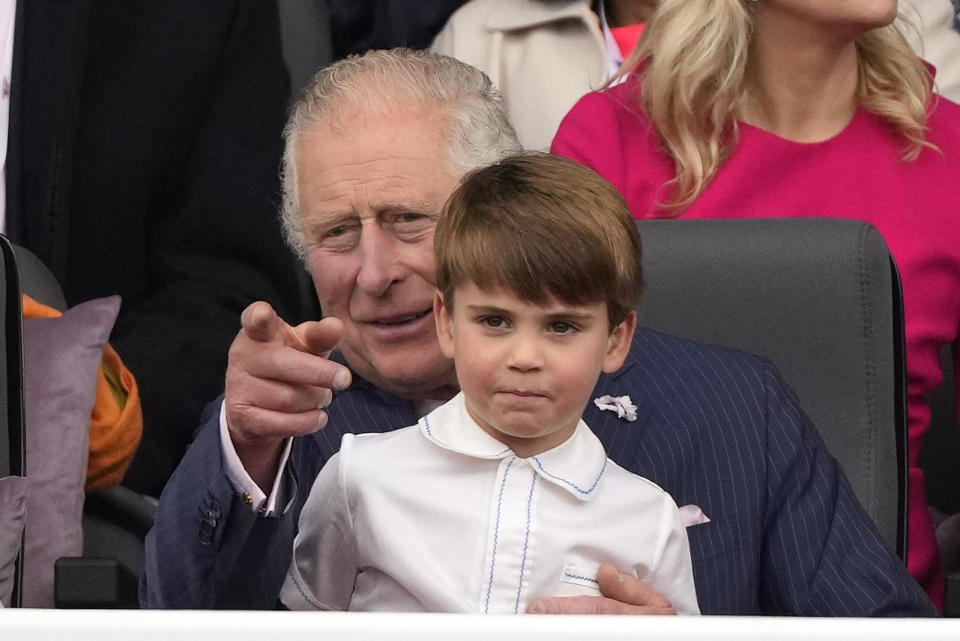 Prince Charles and Prince Louis attend the Platinum Jubilee Pageant outside Buckingham Palace in London, Sunday, June 5, 2022, on the last of four days of celebrations to mark the Platinum Jubilee. (AP Photo/Frank Augstein, Pool)