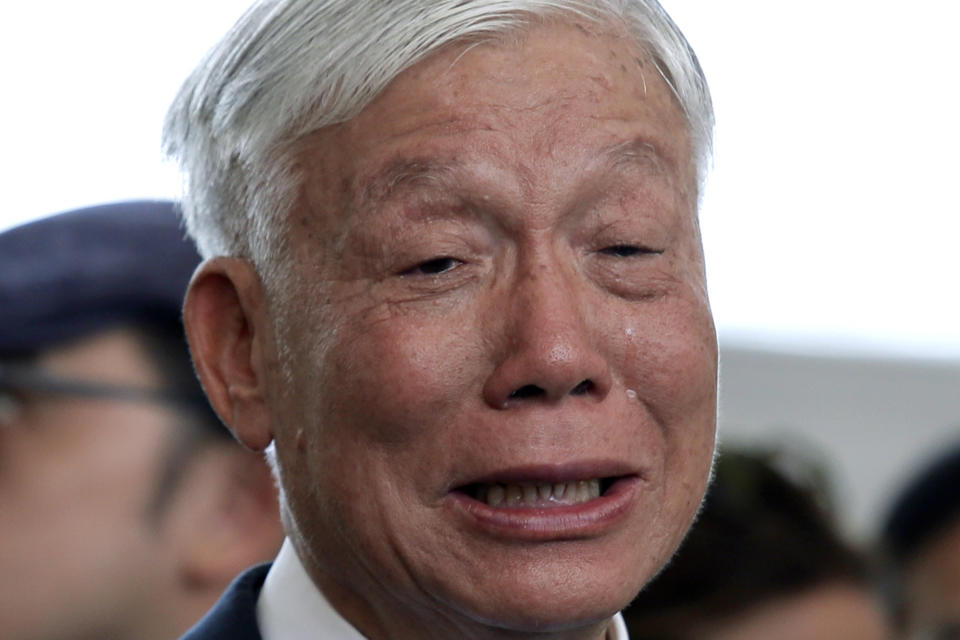 Occupy Central leader Chu Yiu-ming cries as he speaks to media after sentencing at a court in Hong Kong, Wednesday, April 24, 2019. A court in Hong Kong handed down prison sentences of up to 16 months Wednesday to eight leaders of massive 2014 pro-democracy protests on charges of public nuisance offenses. (AP Photo/Kin Cheung)