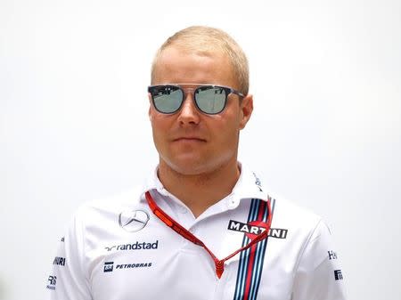 Formula One - F1 - Malaysia Grand Prix - Sepang, Malaysia- 1/10/16 William's Valtteri Bottas of Finland arrives ahead of the third practice. REUTERS/Edgar Su