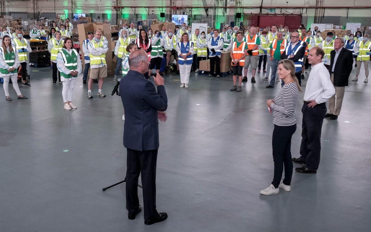 Ron Dennis speaking to Prince Edward, Earl of Wessex and Sophie, Countess of Wessex and volunteers at SaluteTheNHS operations centre in Bicester, July 2 2020 - Adrian Wroth Photography