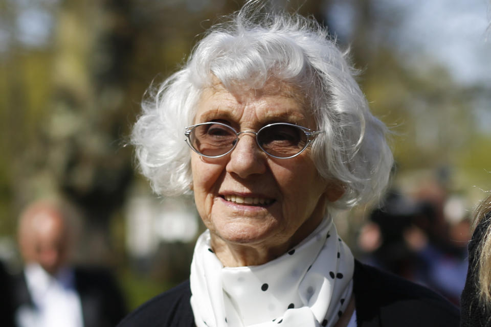 FILE - Auschwitz survivor Eva Pusztai-Fahidi from Budapest leaves the court hall during the noon breaks of the trial against former SS guard Oskar Groening in Lueneburg, northern Germany, Tuesday, April 21, 2015. Holocaust survivor Eva Fahidi-Pusztai, who spent the late years of her life warning of the re-emergence of far-right populism and discrimination against minorities across Europe, has died. She was 97. (AP Photo/Markus Schreiber, File)