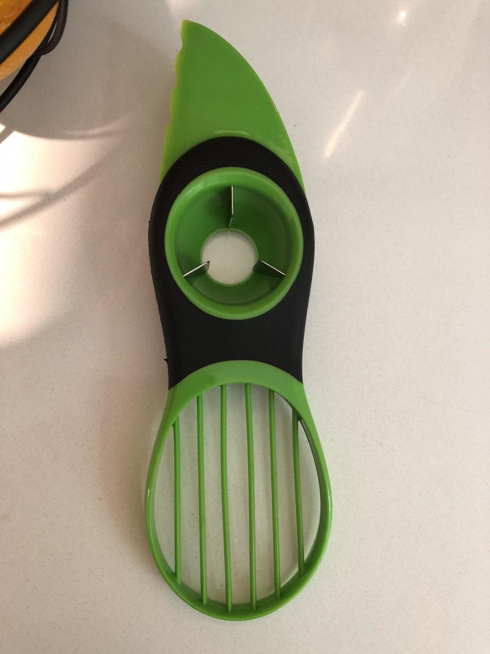 a tool used to cut, pit, and slice avocados