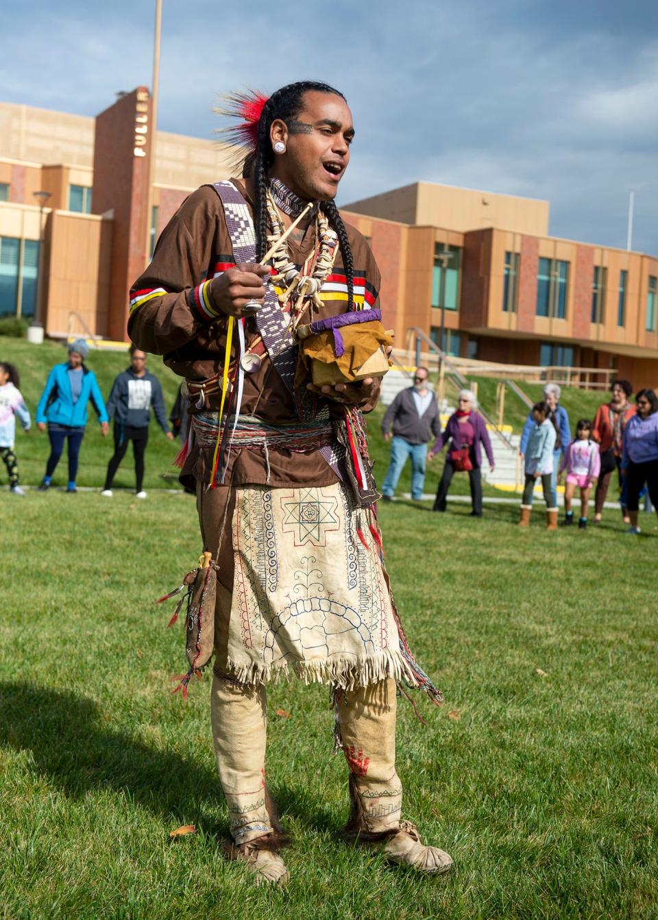 Nipmuc Nation Cultural Steward Andre "Strongbearheart" Gaines, of Grafton, leads a community circle dance at the Fuller Middle School during Framingham Indigenous Peoples' Day Recognition and Celebration, Oct. 10, 2022.