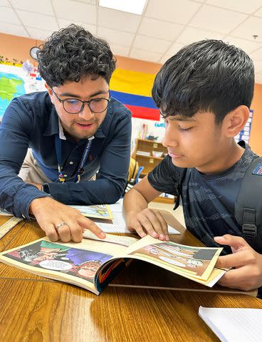 <p>Images Provided by San Antonio ISD</p> Kevin Mora (L) with a student at the Japhet Academy in San Antonio