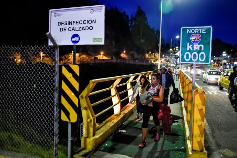 Ascano walks in Tulcan, Ecuador, after crossing from Ipiales, Colombia