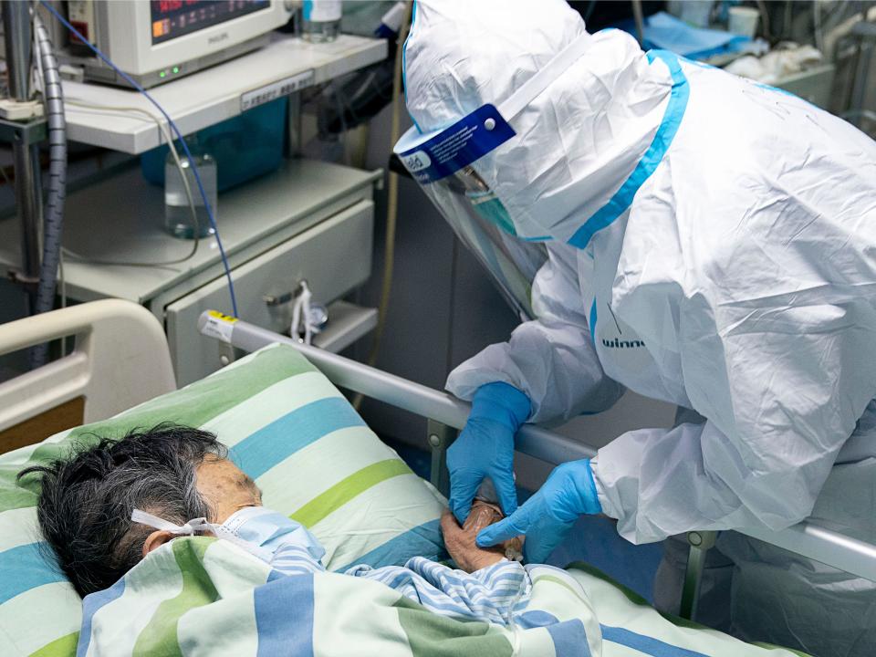 In this Friday, Jan. 24, 2020, photo released by China's Xinhua News Agency, a medical worker attends to a patient in the intensive care unit at Zhongnan Hospital of Wuhan University in Wuhan in central China's Hubei Province. China expanded its lockdown against the deadly new virus to an unprecedented 36 million people and rushed to build a prefabricated, 1,000-bed hospital for victims Friday as the outbreak cast a pall over Lunar New Year, the country's biggest, most festive holiday. (Xiong Qi/Xinhua via AP)