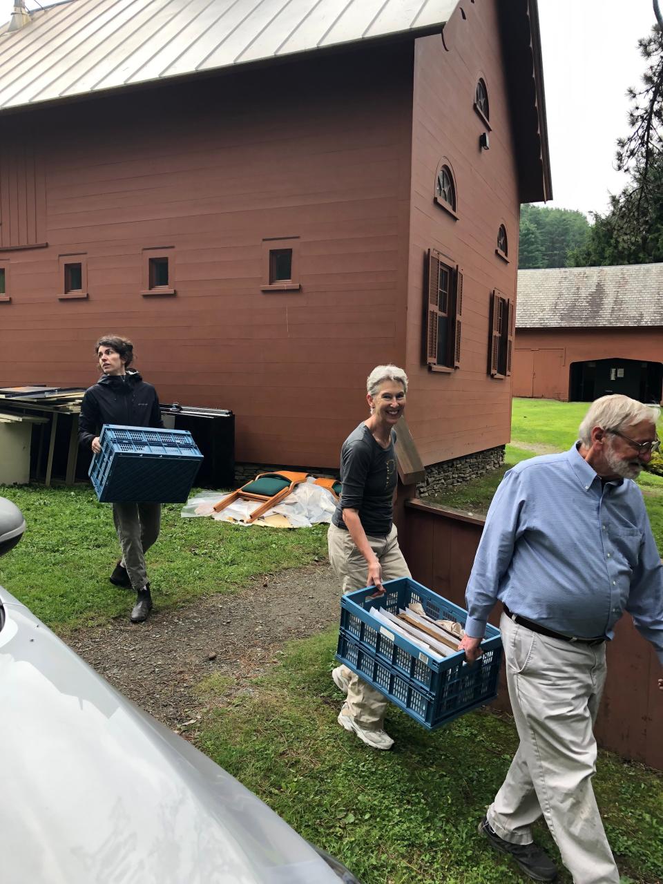 Dartmouth conservator and volunteers pack out crates of wet archival materials from Justin Morrill Homestead in Strafford, Vermont.