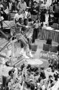 FILE - In this April 5, 1983, file photo, North Carolina State players Cozell McQueen, left, and Ernie Myers celebrate while standing on the rim after defeating Houston 54-52 to win the NCAA college basketball championship in Albuquerque, N.M. (AP Photo/File)