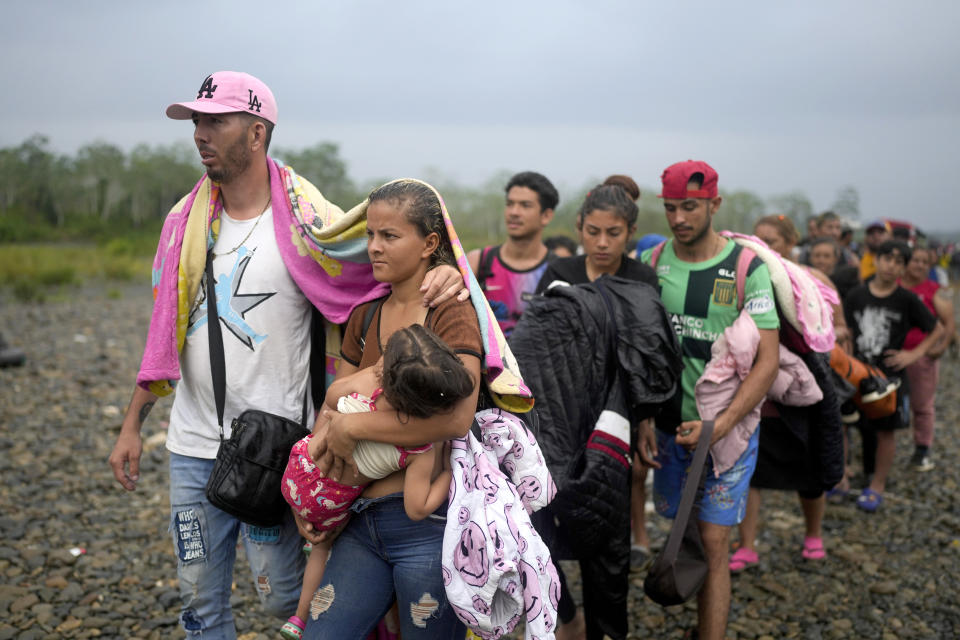 Migrants line up to take a boat after crossing the Darien Gap from Colombia, in Bajo Chiquito, Panama (Natacha Pisarenko / AP file)