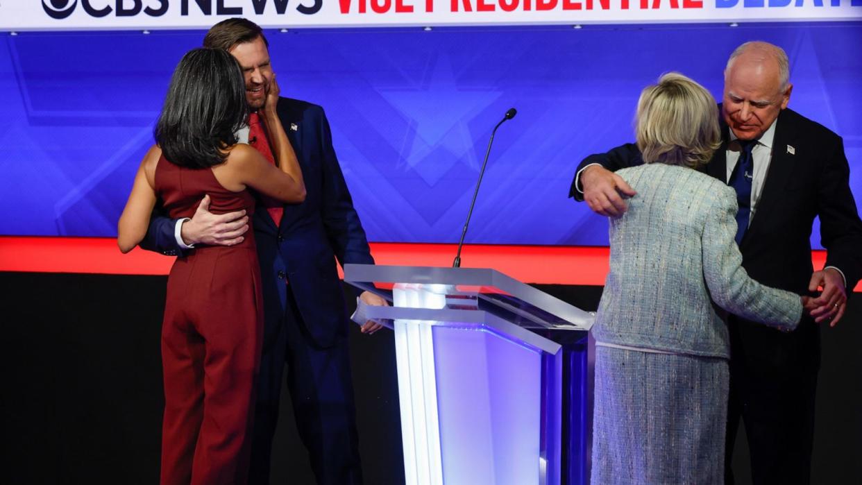 PHOTO: Democratic vice presidential candidate Minnesota Gov. Tim Walz and his wife Gwen Walz (R) and  Republican vice presidential candidate Sen. JD Vance and his wife Usha Vance embrace after their debate, Oct. 1, 2024 in New York City.  (Chip Somodevilla/Getty Images)