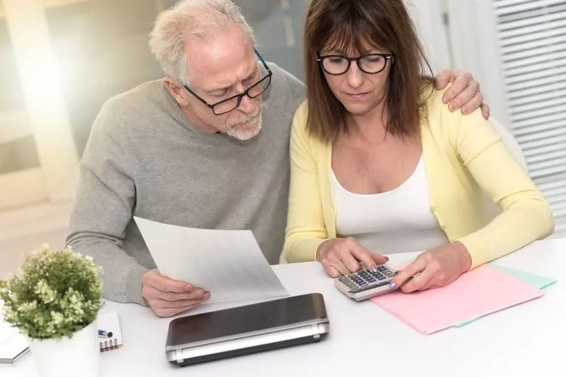 A couple checking their finances