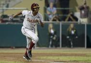 Florida State's Jameis Winston runs to first base after grounding against South Florida during the eighth inning of an NCAA college baseball game Tuesday, March 4, 2014, in Tampa, Fla. (AP Photo/Chris O'Meara)