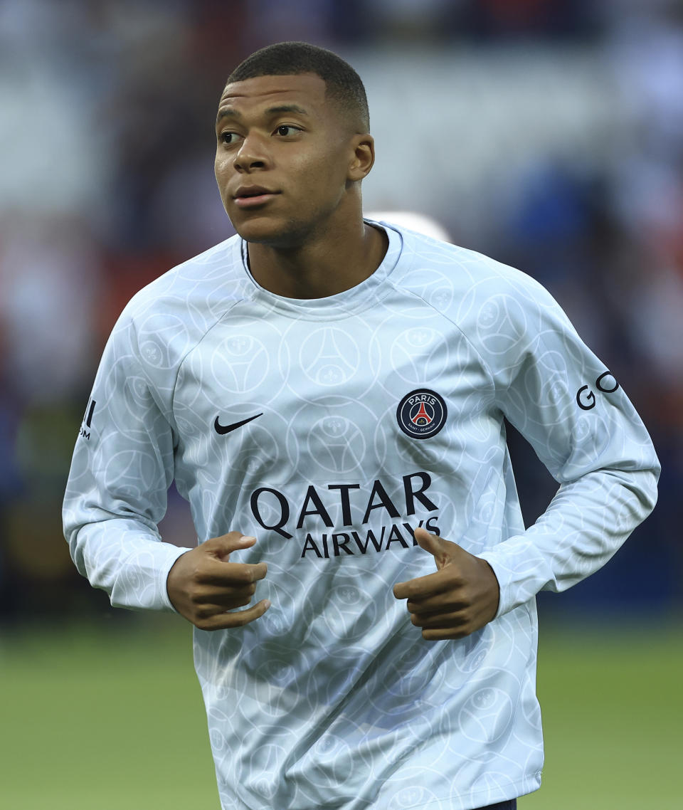 PSG's Kylian Mbappe warms up prior to the French League One soccer match between Paris Saint-Germain and Monaco at the Parc des Princes in Paris, France, Sunday, Aug. 28, 2022. (AP Photo/Aurelien Morissard)