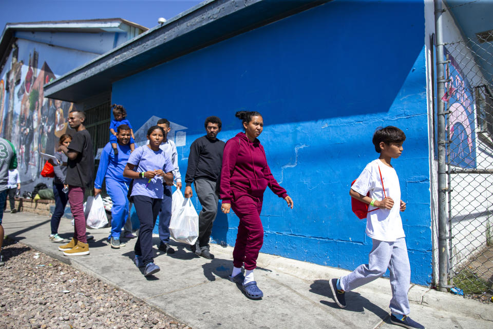 A migrant family from Venezuela arrives to the shelter run by the Sacred Heart Church in El Paso, Texas, Friday, May 12, 2023. The border between the U.S. and Mexico was relatively calm Friday, offering few signs of the chaos that had been feared following a rush by worried migrants to enter the U.S. before the end of pandemic-related immigration restrictions. (AP Photo/Andres Leighton)