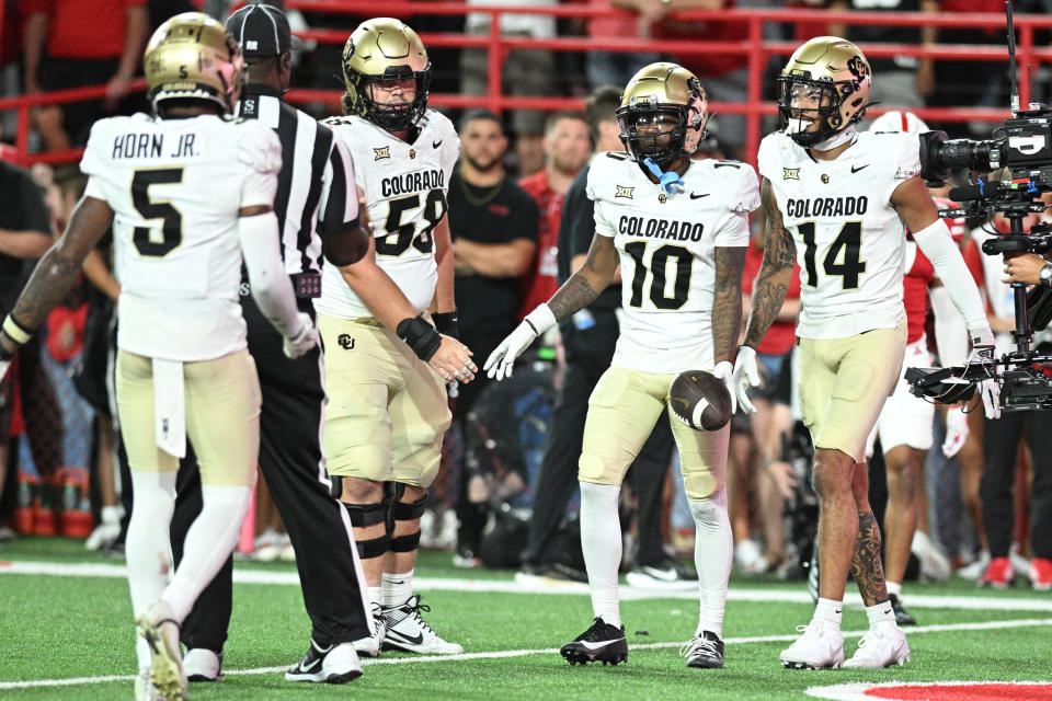 LINCOLN, NEBRASKA - SEPTEMBER 07: LaJohntay Wester #10 of the Colorado Buffaloes celebrates scoring a touchdown with Will Sheppard #14 and Jimmy Horn Jr. #5 against the Nebraska Cornhuskers during the fourth quarter at Memorial Stadium on September 7, 2024 in Lincoln, Nebraska. (Photo by Steven Branscombe/Getty Images)