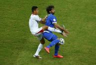 Costa Rica's Oscar Duarte (L) fights for the ball with Greece's Giorgios Samaras during their 2014 World Cup round of 16 game at the Pernambuco arena in Recife June 29, 2014. REUTERS/Ruben Sprich