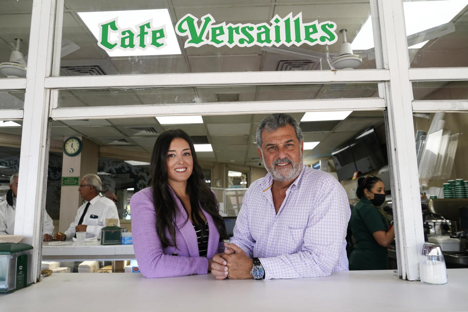 Felipe Valls Jr., right, owner of Versailles Restaurant, right, poses for a photograph with his daughter Nicole Valls at Versailles Restaurant in Miami on Aug. 30, 2021. (Lynne Sladky / AP file)