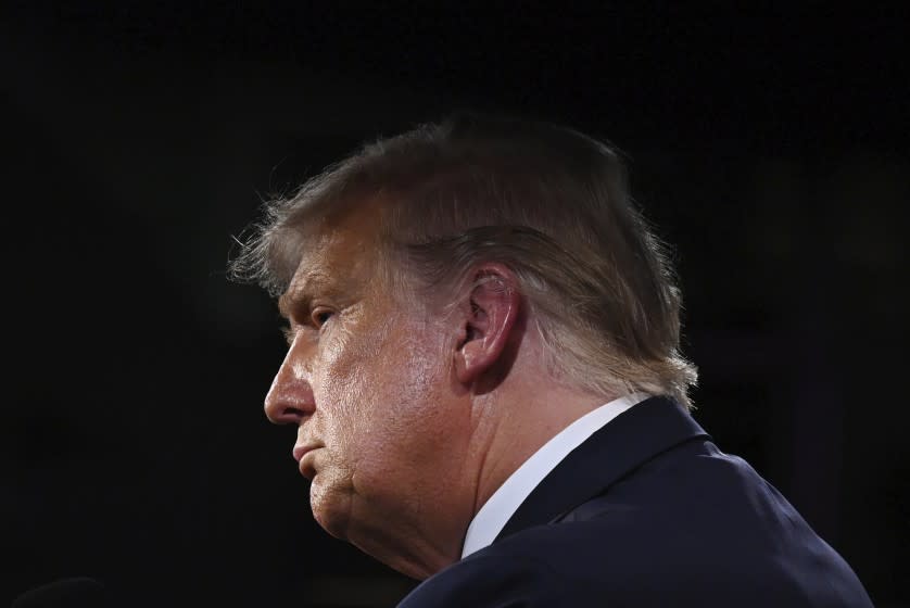 President Donald Trump listens during the first presidential debate with Democratic presidential candidate former Vice President Joe Biden Tuesday, Sept. 29, 2020, at Case Western University and Cleveland Clinic, in Cleveland. (Olivier Douliery/Pool vi AP)