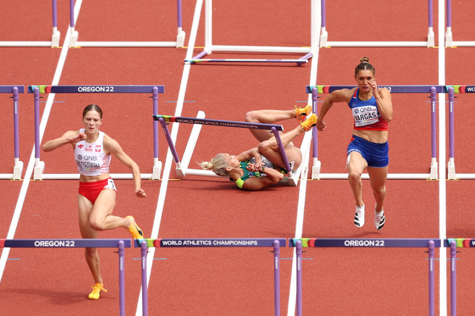 EUGENE, OREGON - JULY 23: Liz Clay of Team Australia (C) falls as they compete in the Women's 100m Hurdles heats on day nine of the World Athletics Championships Oregon22 at Hayward Field on July 23, 2022 in Eugene, Oregon. (Photo by Patrick Smith/Getty Images)