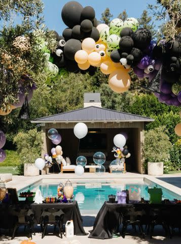 <p>Khloe Kardashian/Instagram</p> A giant balloon arch soared over the front of the pool.