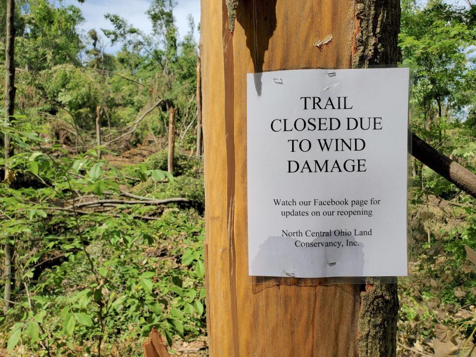 A sign posted near the Cole Road Prairie between Butler and Perrysville advises that the trail is closed in this area, which sustained heavy damage from the June 13 tornado. The property is part of North Central Ohio Land Conservancy's Clear Fork Valley Scenic Trail.