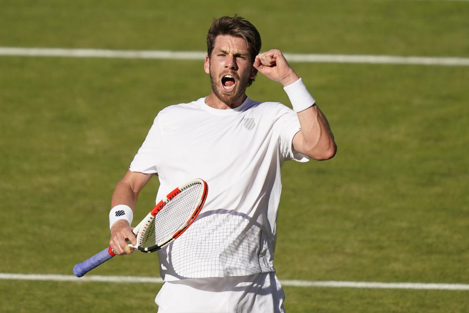 Britain's Cameron Norrie celebrates as he holds serve against Serbia's Novak Djokovic in a men's singles semifinal on day twelve of the Wimbledon tennis championships in London, Friday, July 8, 2022. (AP Photo/Gerald Herbert)