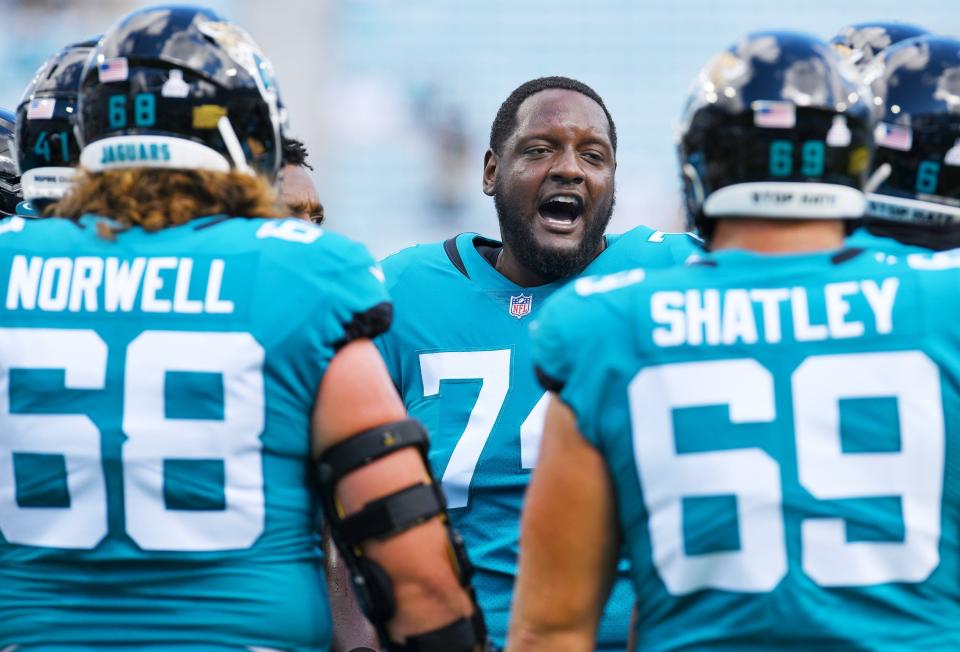 Jaguars offensive tackle Cam Robinson (74) gets his teammates pumped up before the start of the Oct. 10 game against the Tennessee Titans.