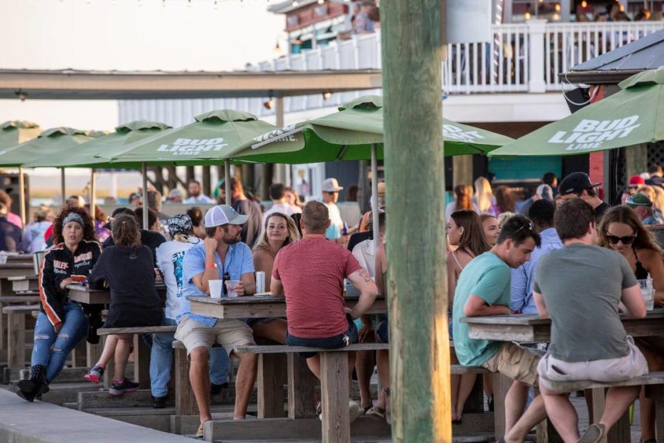 Diners gather around local restaurants at the Murrells Inlet Marsh Walk. May 16, 2020