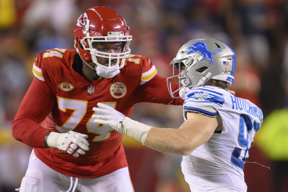 Kansas City Chiefs offensive tackle Jawaan Taylor (74) blocks against Detroit Lions defensive end Aidan Hutchinson (97)during the second half of an NFL football game, Thursday, Sept. 7, 2023 in Kansas City, Mo. (AP Photo/Reed Hoffmann)