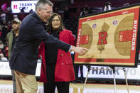 Director of Athletics at Rutgers University, Pat Hobbs, left, with former Rutgers head coach, C. Vivian Stringer, at a ceremony held in her honor during half time at the Big Ten Conference women's college basketball game between the Rutgers Scarlet Knights and the Ohio State Buckeyes in Piscataway, N.J., Sunday, Dec. 4, 2022. (AP Photo/Stefan Jeremiah)