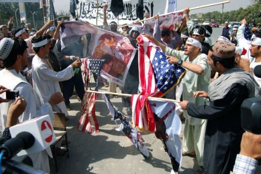 Afghan demonstrators burn US flags and photos of actors and actresses who took part in the film "Innocence of Muslims" during a protest in Kabul. The US government compiled a YouTube film of ordinary Americans condemning "Innocence of Muslims."