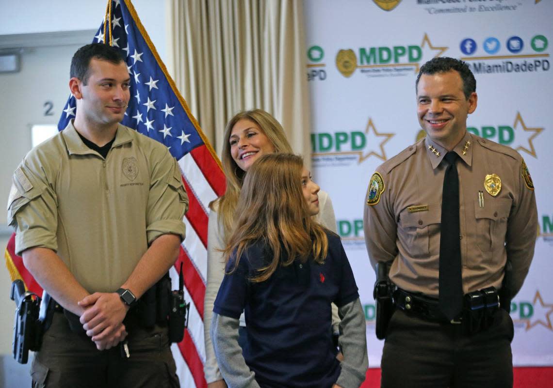 Newly appointed Miami-Dade Police Department Director Alfredo ‘Freddy’ Ramirez smiles alongside his wife Jody, and their children Ryan, 11, and Brandon during a press conference at Miami-Dade Police Department Headquarters on Wednesday, Jan. 8, 2020, in Doral.