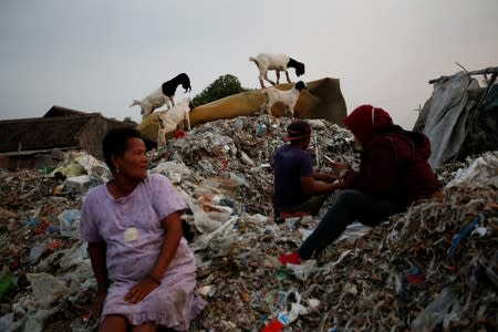 The Wider Image: Cash for trash: Indonesia village banks on waste recycling