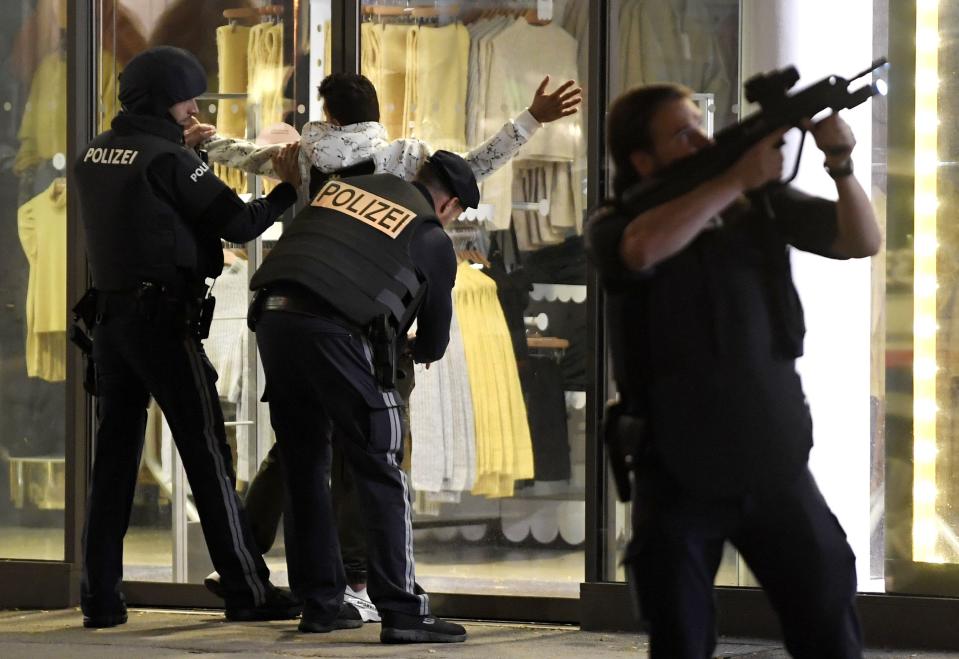 Police control a person at Mariahilferstrasse in central Vienna on November 2, 2020, following a shooting near a synagogue. - Austrian Interior Minster Nehammer said late on November 2 that a shooting in central Vienna near a major synagogue appeared to be a terrorist attack and was ongoing. (Photo by ROLAND SCHLAGER / APA / AFP) / Austria OUT (Photo by ROLAND SCHLAGER/APA/AFP via Getty Images)