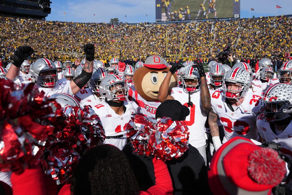 Nov 25, 2023; Ann Arbor, Michigan, USA; The Ohio State Buckeyes huddle for the quick cals drill prior to the NCAA football game against the Michigan Wolverines at Michigan Stadium.