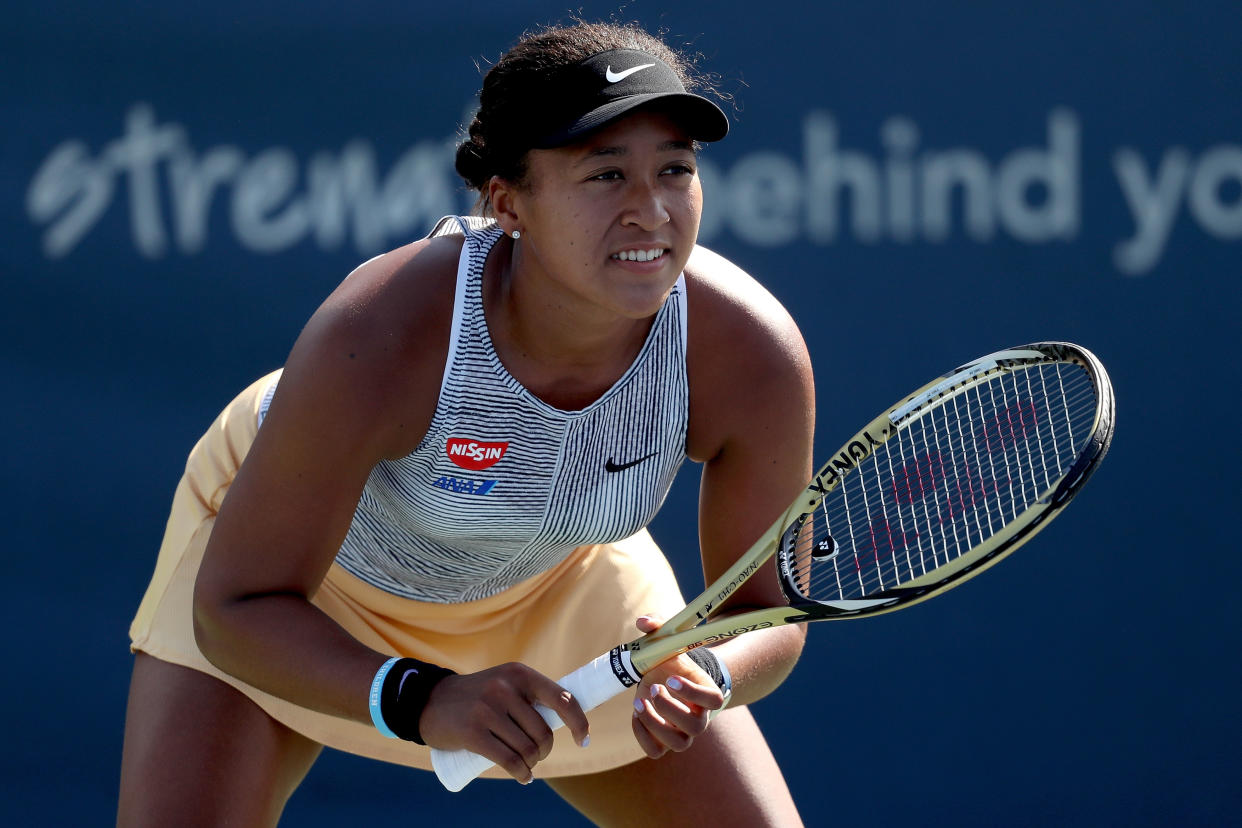 Naomi Osaka retired with a knee injury two weeks prior to the start of the U.S. Open. (Getty)