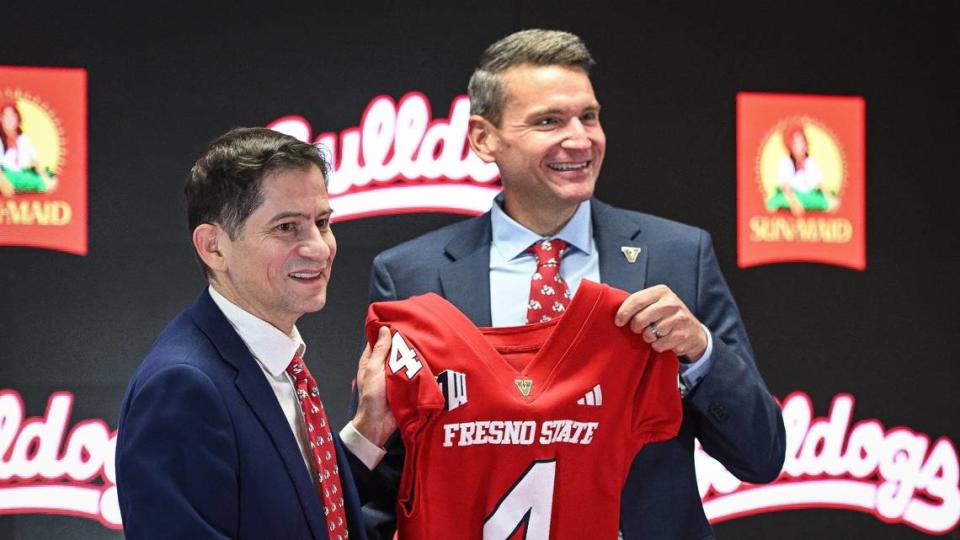 Garrett Klassy, right, is introduced as Fresno State’s new athletic director by Fresno State President Dr. Saul Jimenez-Sandoval during a news conference at Fresno State’s Josephine Theater on Friday, June 28, 2024.