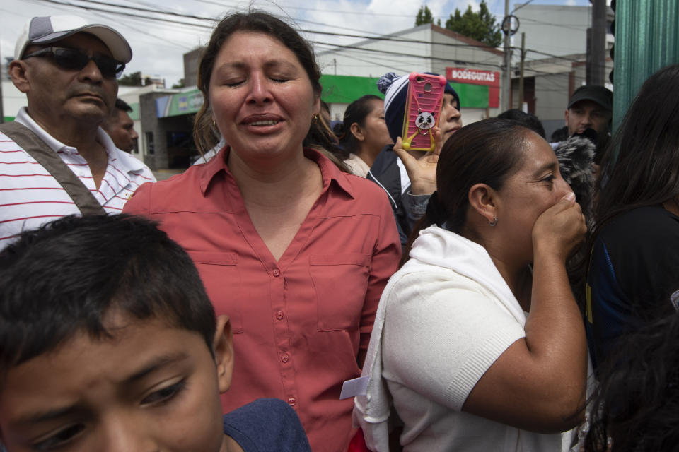 Family members wait outside the Air Force Base for the arrival of their relatives, who were deported from the United States, in Guatemala City, Tuesday, July 16, 2019. Nearly 200 Guatemalan migrants have been deported on Tuesday, the day the Trump administration planned to launch a drastic policy change designed to end asylum protections for most migrants who travel through another country to reach the United States. (AP Photo/Moises Castillo)