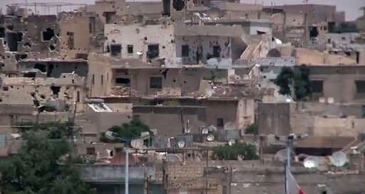 An image grab taken from a video released by the United Nations Supervision Mission in Syria (UNSMIS) shows shelled houses in the central flashpoint city of Homs