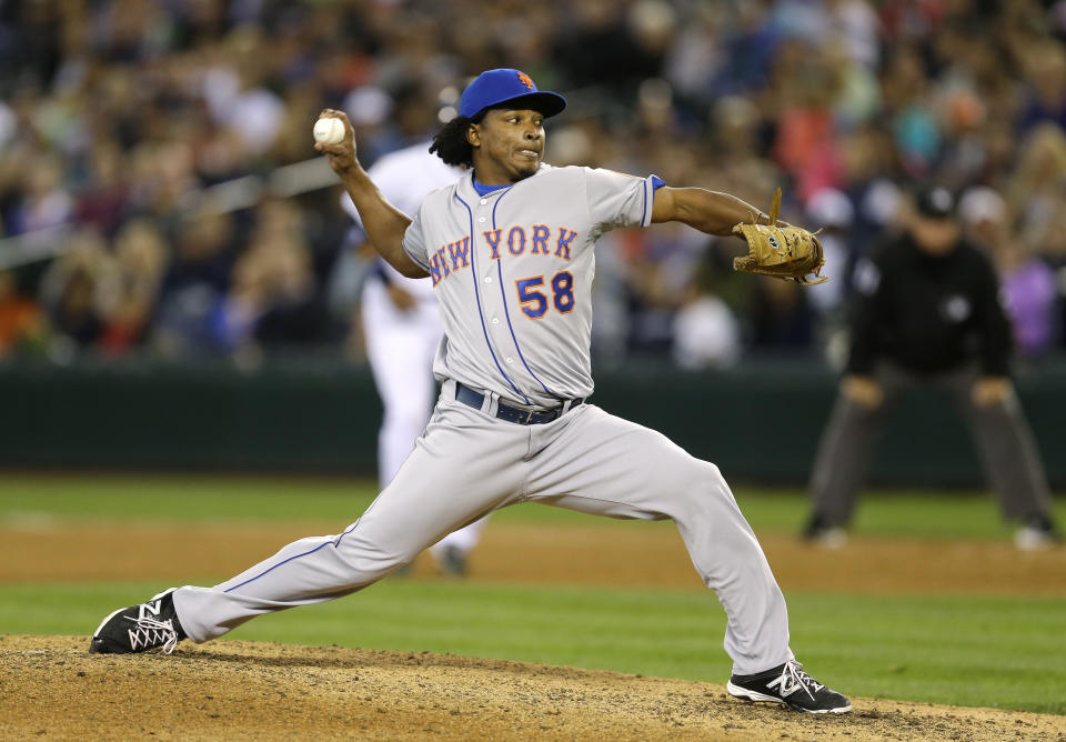 FILE - In this July 23, 2014, file photo, New York Mets closing pitcher Jenrry Mejia throws against the Seattle Mariners in the ninth inning of a baseball game in Seattle. Mejia was released by the New York Mets after serving three drug suspensions. The 29-year-old right-hander was told in July by baseball Commissioner Rob Manfred that he could return to the big leagues in 2019. Mejia was suspended for life on Feb. 12, 2016, after his third positive test for a banned steroid. The drug agreement allowed him to apply a year later for reinstatement that would be effective a minimum two years after the ban started, with the decision at the commissioner's discretion. (AP Photo/File)