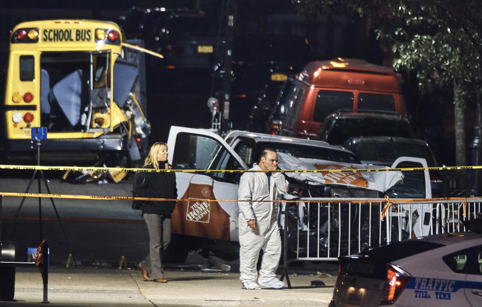 FILE - Police work near a damaged Home Depot truck, Nov. 1, 2017, after a motorist drove onto a bike path the day before, Oct. 31, near the World Trade Center memorial, striking and killing several people, in New York. Relatives of eight people killed in the Halloween terror attack on a New York City bike path, as well as those who were injured, are expected to speak at a Wednesday, May 17, 2023, sentencing hearing for an Islamic extremist who prosecutors say deserves multiple life sentences. (AP Photo/Andres Kudacki, File)