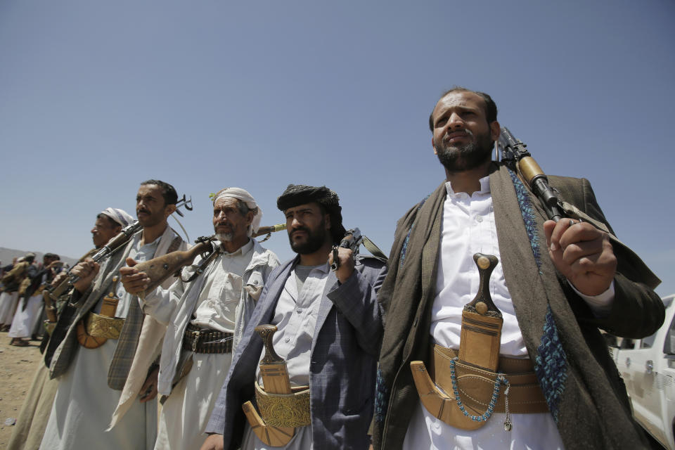 Shiite Houthi tribesmen hold their weapons during a tribal gathering showing support for the Houthi movement, in Sanaa, Yemen, Saturday Sept. 21, 2019. Yemen's Houthi rebels said late Friday night that they were halting drone and missile attacks against Saudi Arabia, one week after they claimed responsibility for a strike that crippled a key oil facility in the kingdom. (AP Photo/Hani Mohammed)