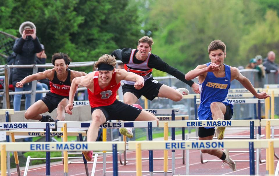 Bedford's Sawyer Ulery of Bedford leads Michael Armetta of Jefferson in the finals of the high hurdles at the 59th annual Mason Invitational on Saturday, May 11, 2024. . Also pictured are Caiden Lambers of Milan and Summerfield's Teddy Gault